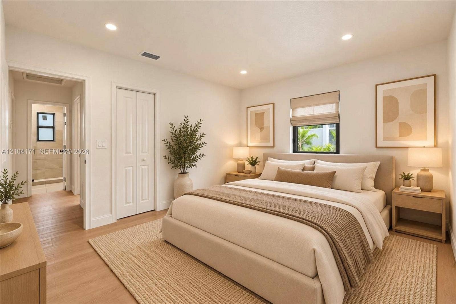 745 NW 32nd Avenue, Miami, FL 33125 Neutral-toned interior featuring recessed lighting, wood-finish flooring, and a window with a roller shade