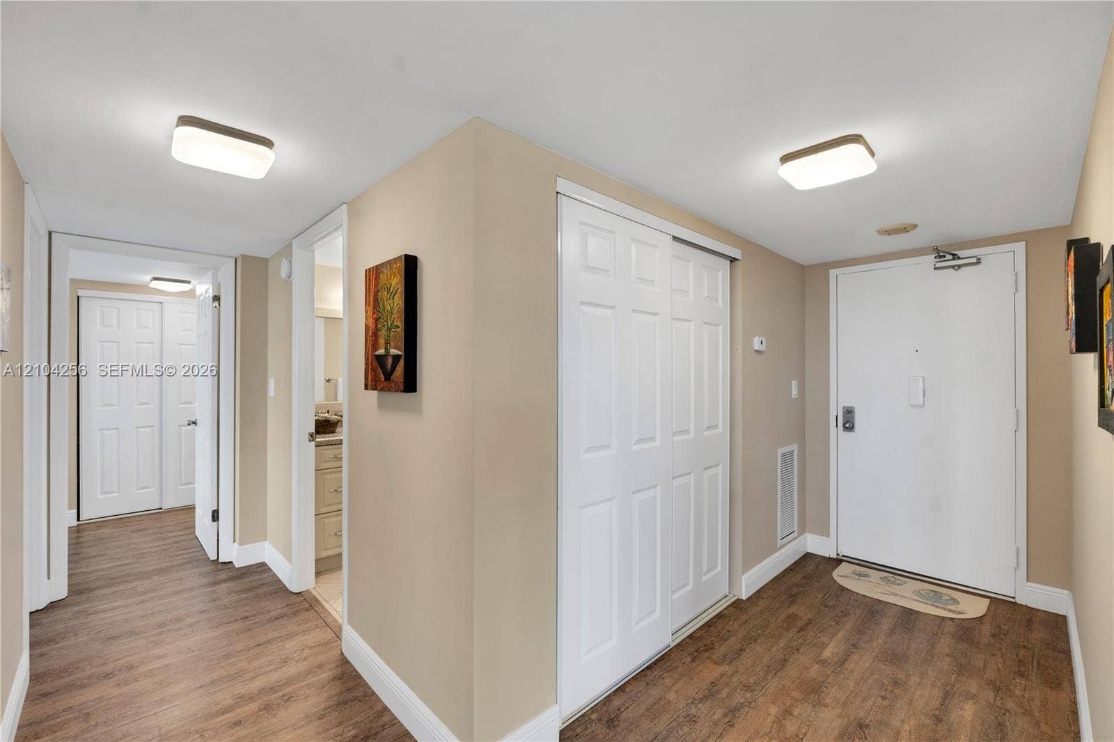 10777 W Sample Road, #907, Coral Springs, FL 33065 Entry and hallway to Guest bath, Master BR, 2nd BR