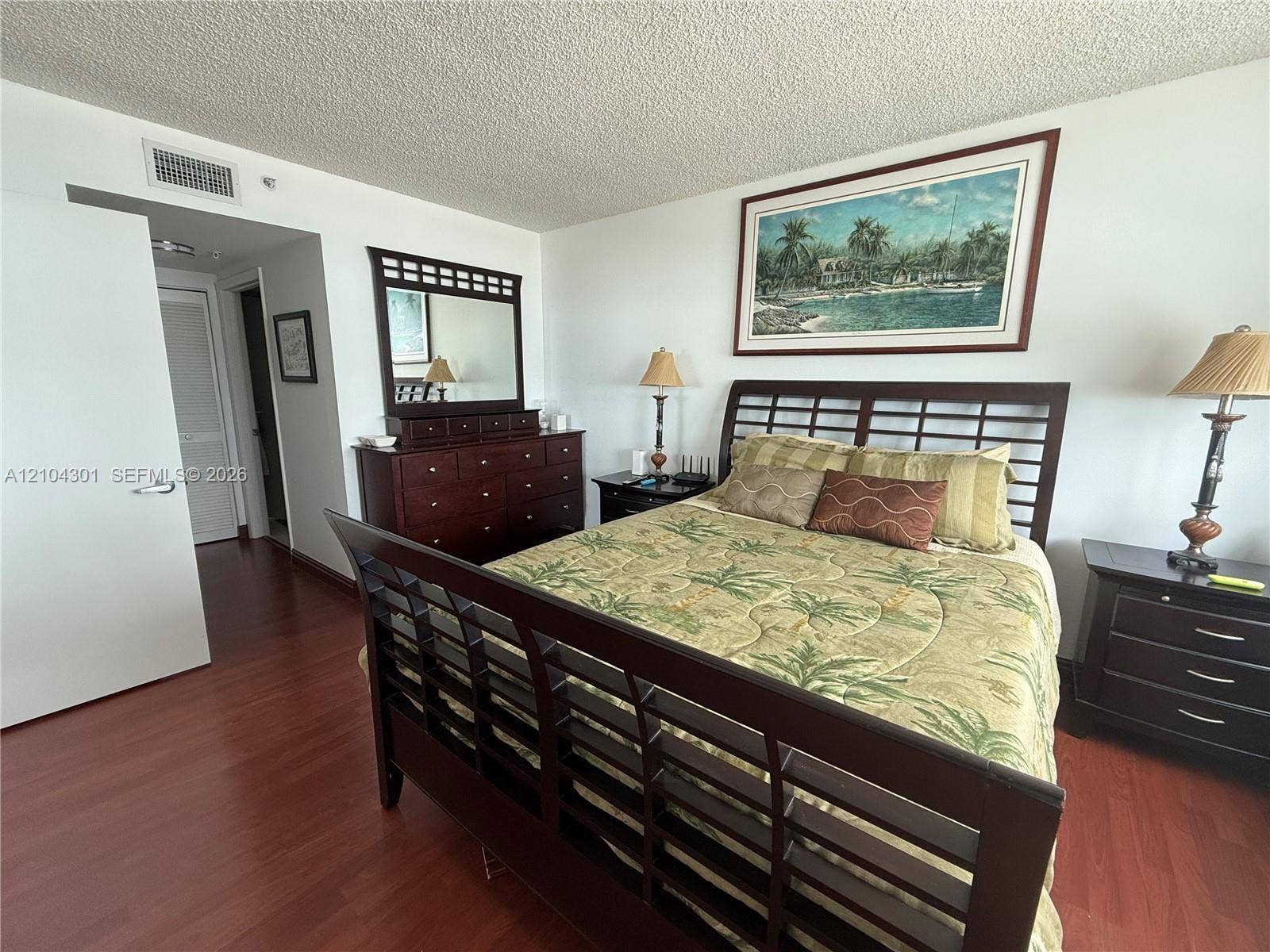 Interior space featuring dark wood-finish flooring and white walls