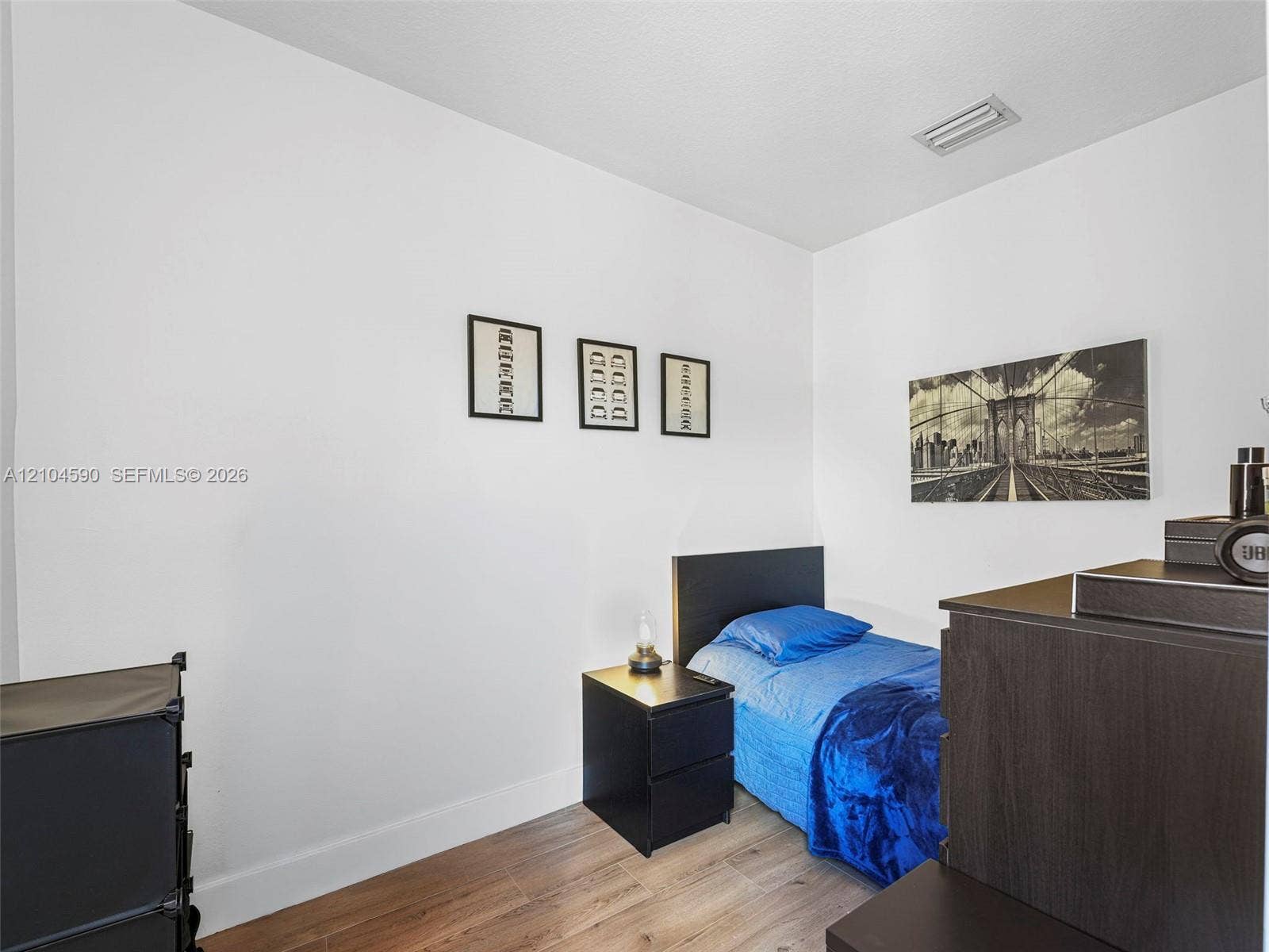Neutral-toned walls paired with wood-finish flooring