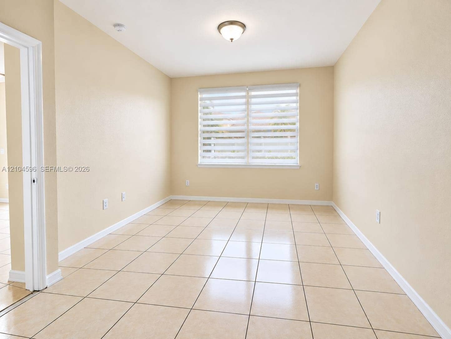 10968 SW 236th Terrace, Homestead, Homestead, FL 33032 Room featuring ceramic tile flooring, neutral wall paint, and dual-layered window shades