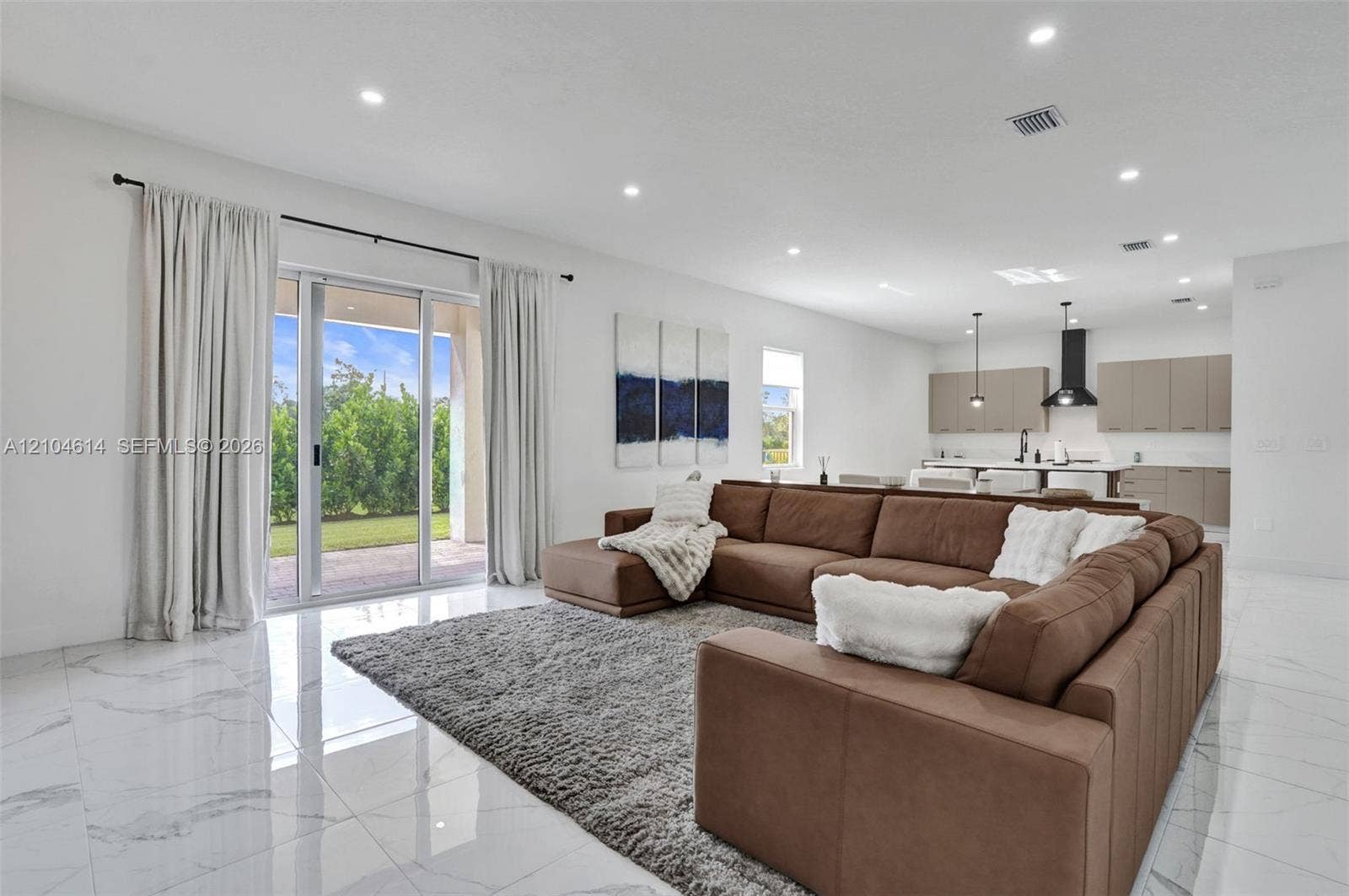 12240 SW 44th Court, Davie, FL 33330 Sliding glass doors provide access to the exterior