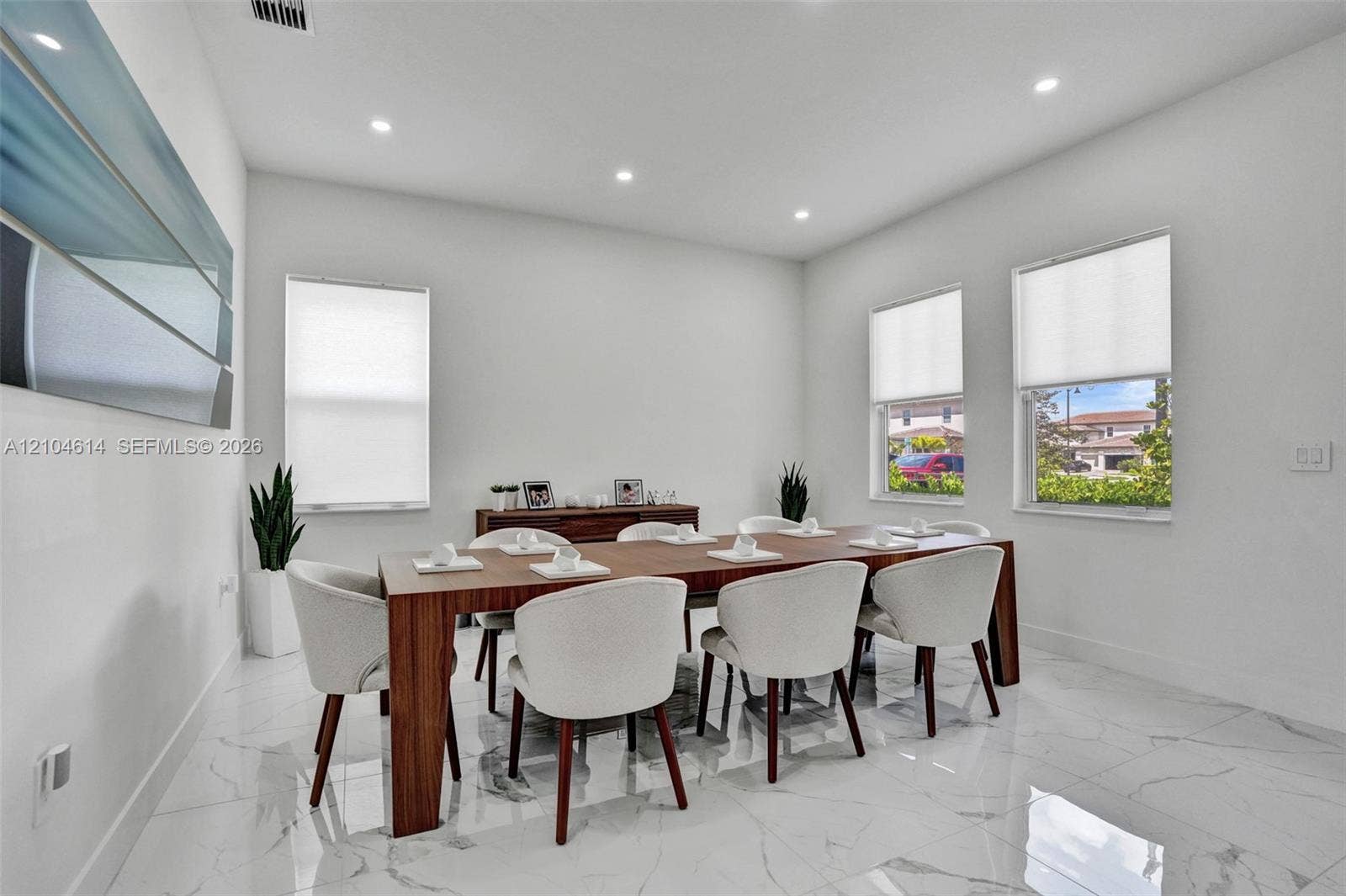 12240 SW 44th Court, Davie, FL 33330 Spacious room featuring glossy white tile flooring, recessed lighting, and multiple windows