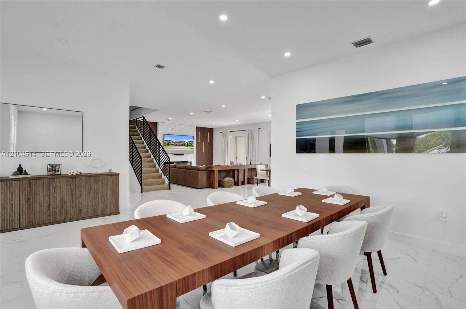 12240 SW 44th Court, Davie, FL 33330 Spacious open-concept living area, recessed lighting, and white flooring