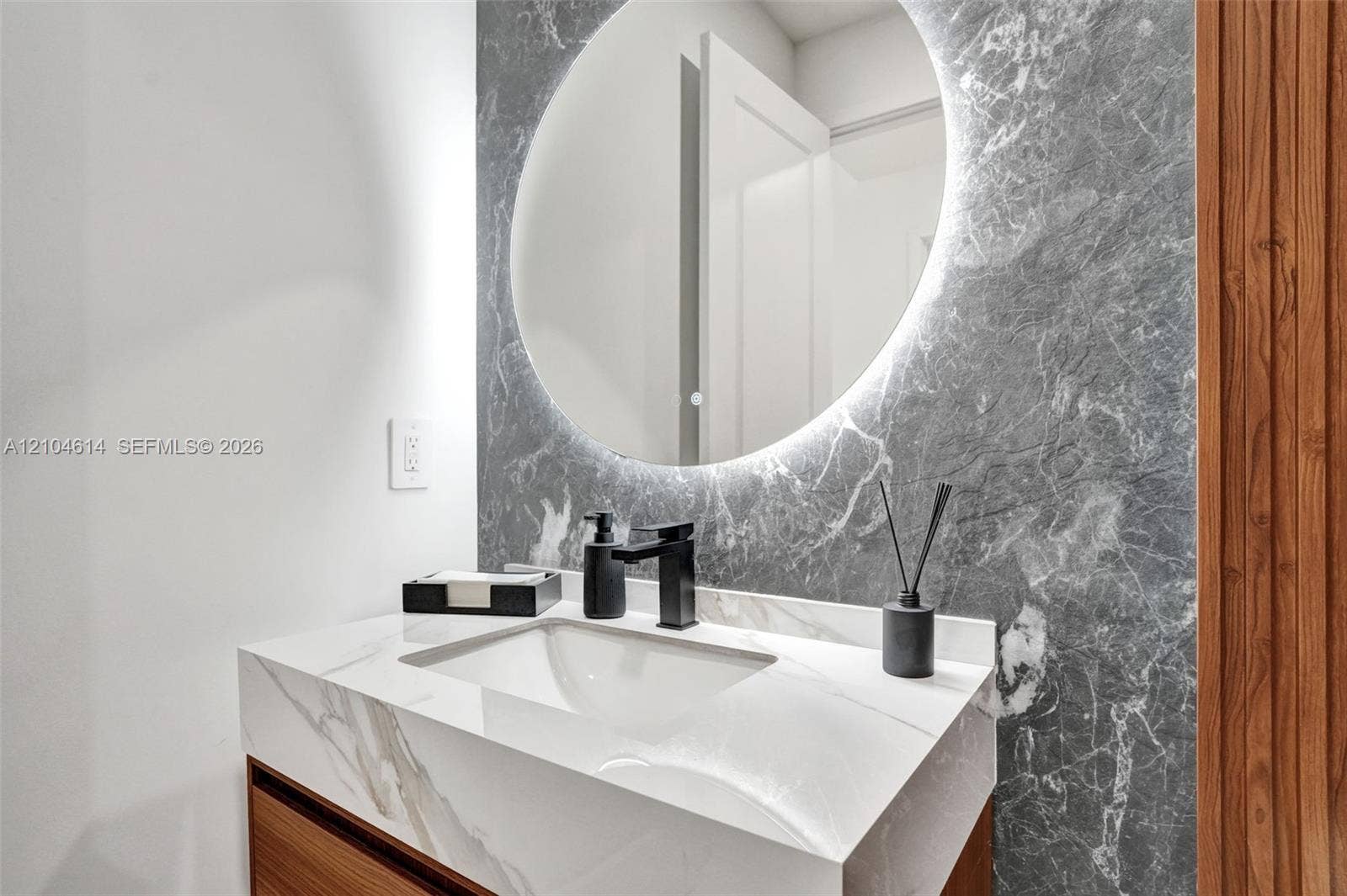 12240 SW 44th Court, Davie, FL 33330 Floating vanity with an integrated sink and white stone look countertop