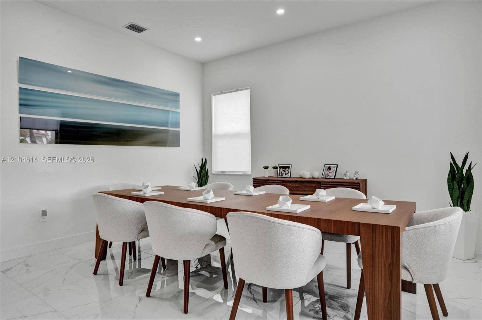 12240 SW 44th Court, Davie, FL 33330 White walls and high ceilings with recessed lighting, complemented by sleek white tile flooring