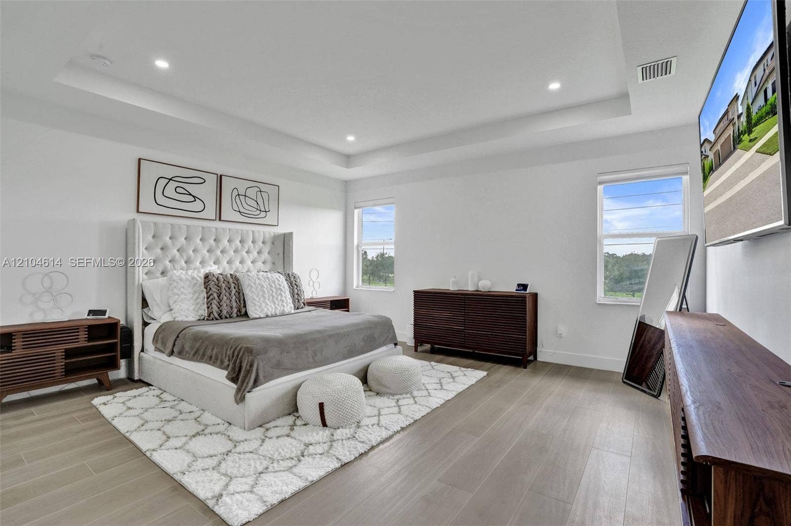 12240 SW 44th Court, Davie, FL 33330 Tray ceiling with recessed lighting, wood look flooring, and multiple windows