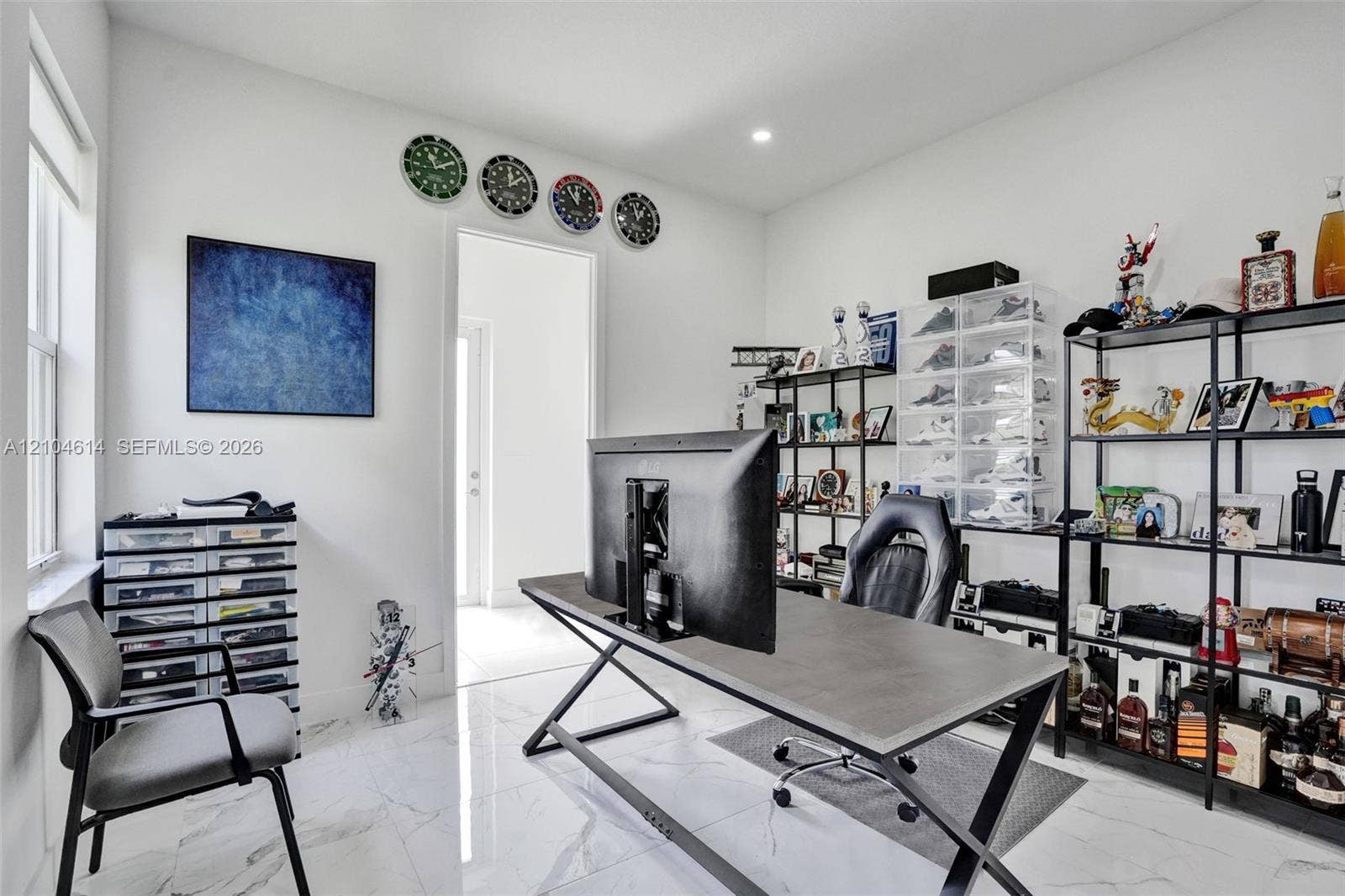 12240 SW 44th Court, Davie, FL 33330 Recessed lighting, marble look flooring, white walls, and a large window
