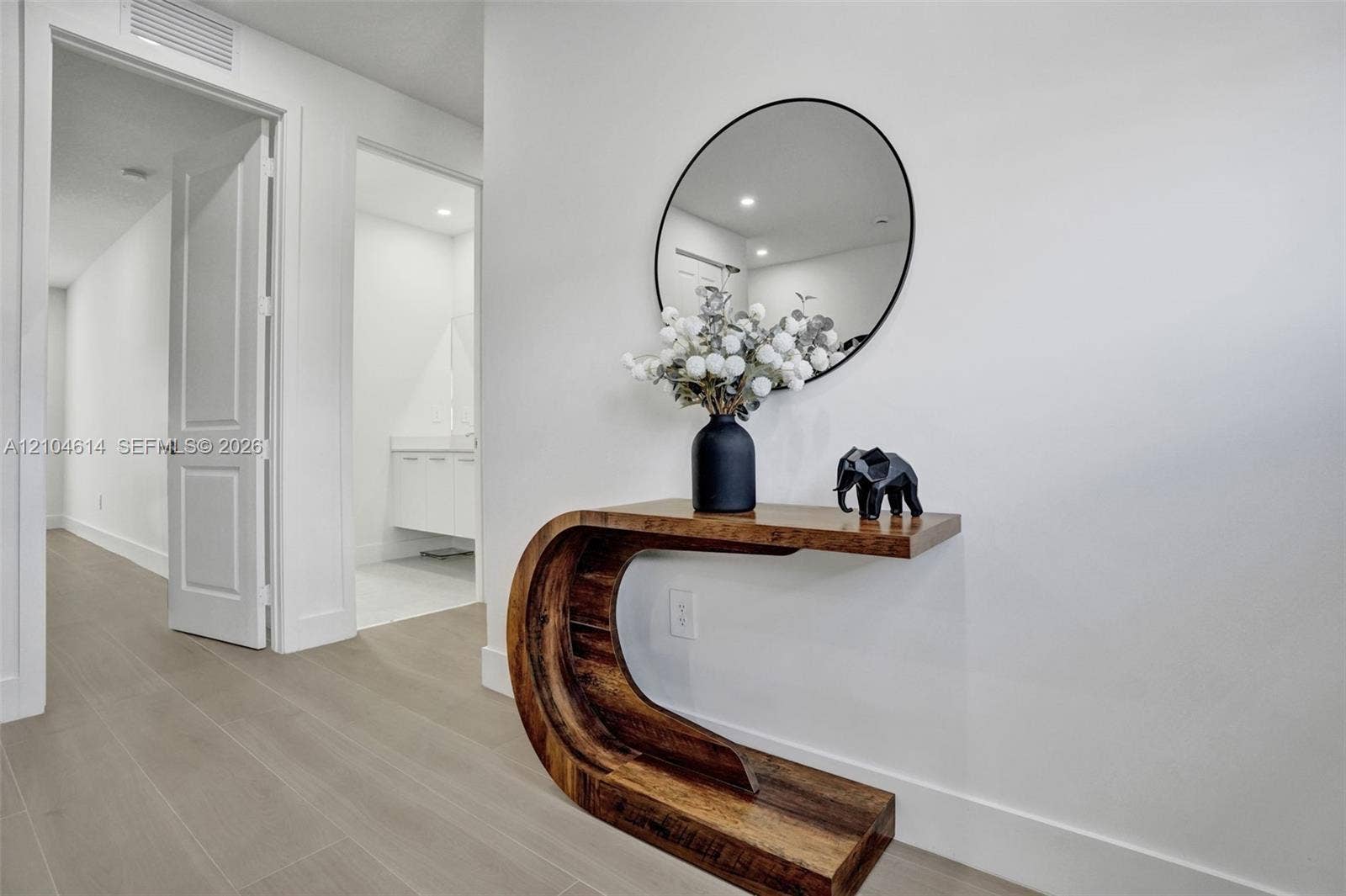 12240 SW 44th Court, Davie, FL 33330 Clean white walls, light wood look flooring, white trim