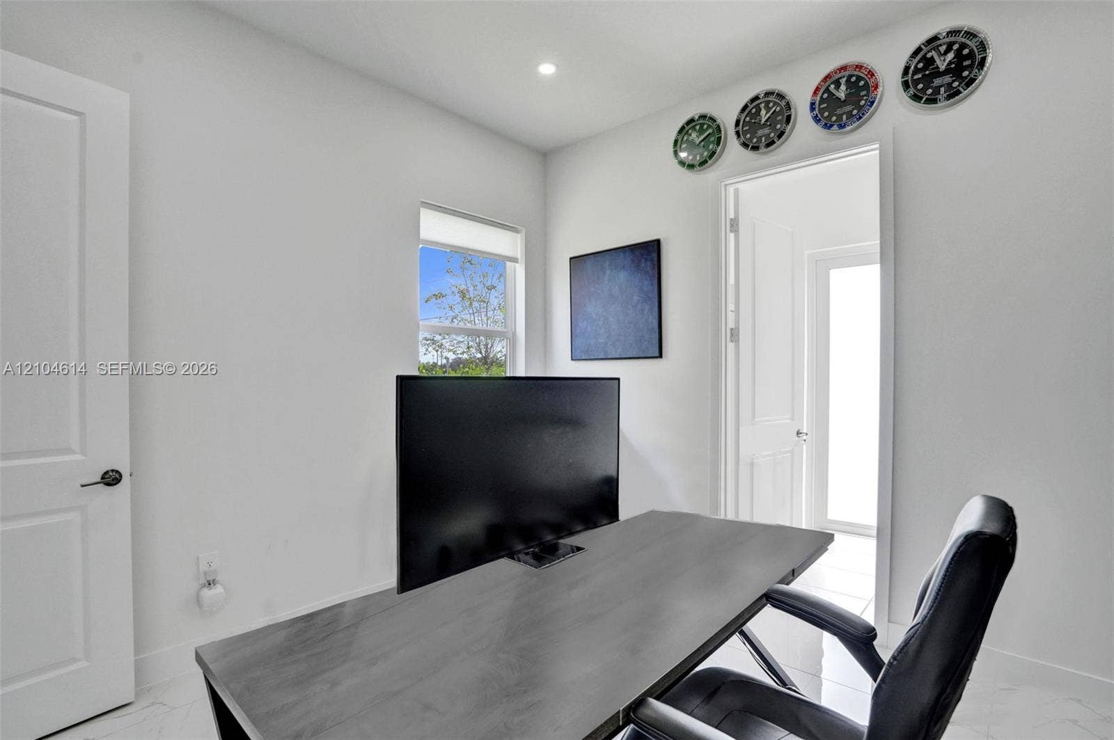 12240 SW 44th Court, Davie, FL 33330 White interior walls, recessed ceiling lighting, light-toned flooring, and a white interior door with dark hardware
