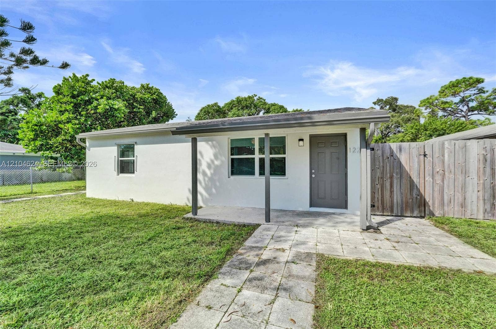 1223 NW 6th Avenue, Fort Lauderdale, FL 33311 Front unit: fresh exterior paint and hurricane-rated impact windows and doors