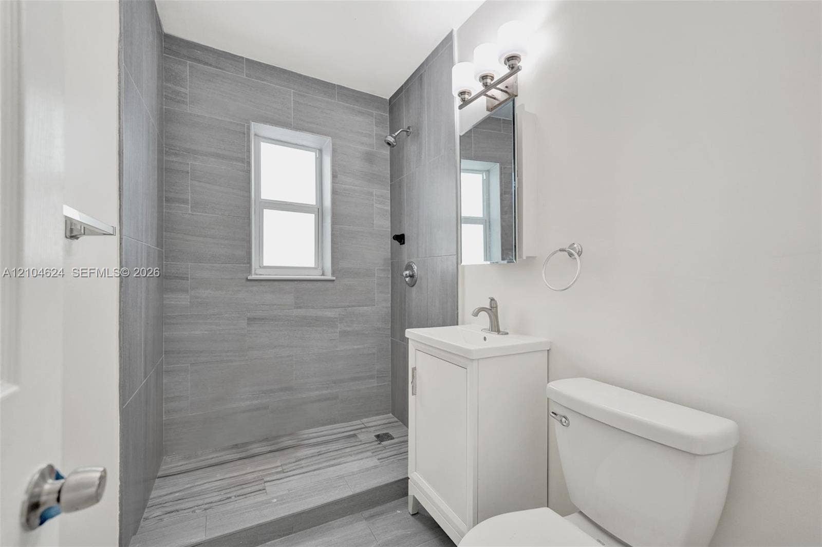 1223 NW 6th Avenue, Fort Lauderdale, FL 33311 Updated bath with tiled walk-in shower
