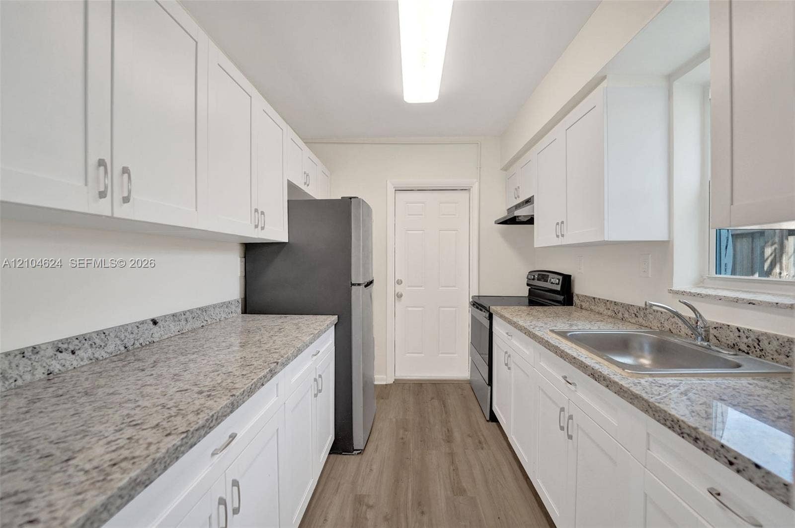1223 NW 6th Avenue, Fort Lauderdale, FL 33311 3/1 kitchen: shaker cabinets, granite counters, stainless appliances