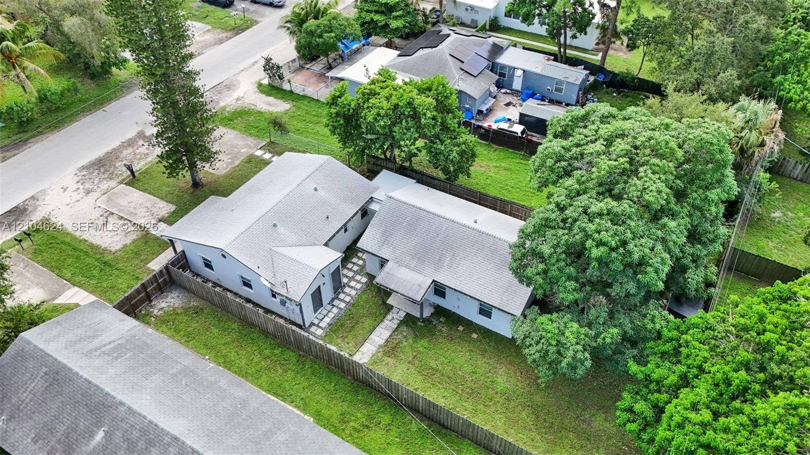 1223 NW 6th Avenue, Fort Lauderdale, FL 33311 Fenced duplex lot with two separate buildings and mature shade trees