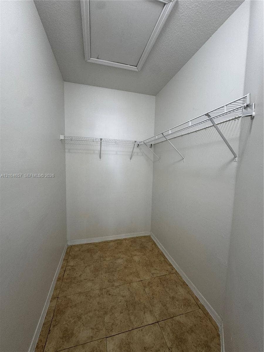 Primary bedroom walking closet