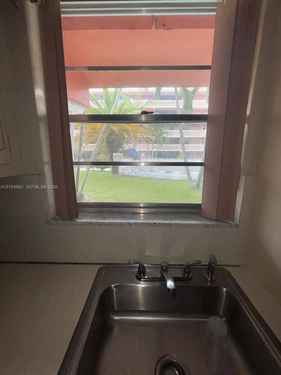180 NE 12th Avenue, #12A, Hallandale Beach, Hallandale Beach, FL 33009 Stainless steel sink with dual handles and a central faucet