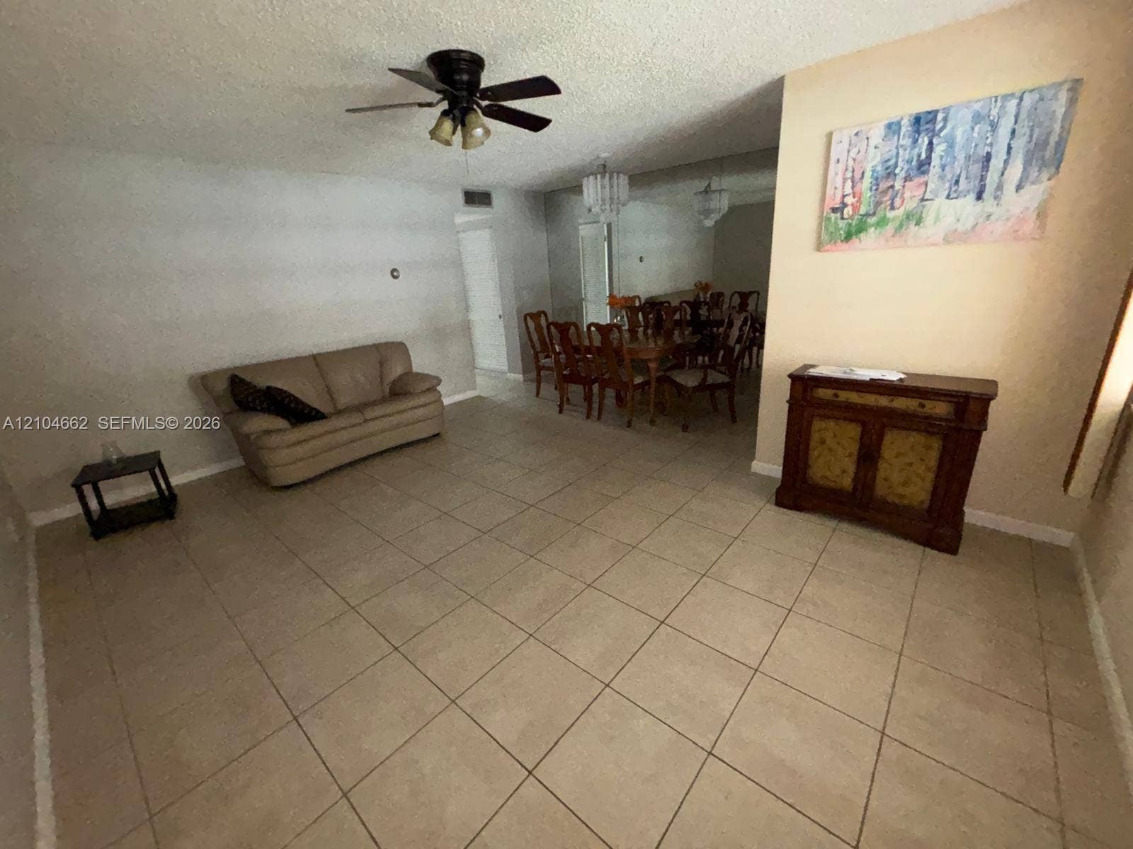180 NE 12th Avenue, #12A, Hallandale Beach, Hallandale Beach, FL 33009 Tiled flooring throughout, ceiling fan with integrated lighting, and a separate dining area