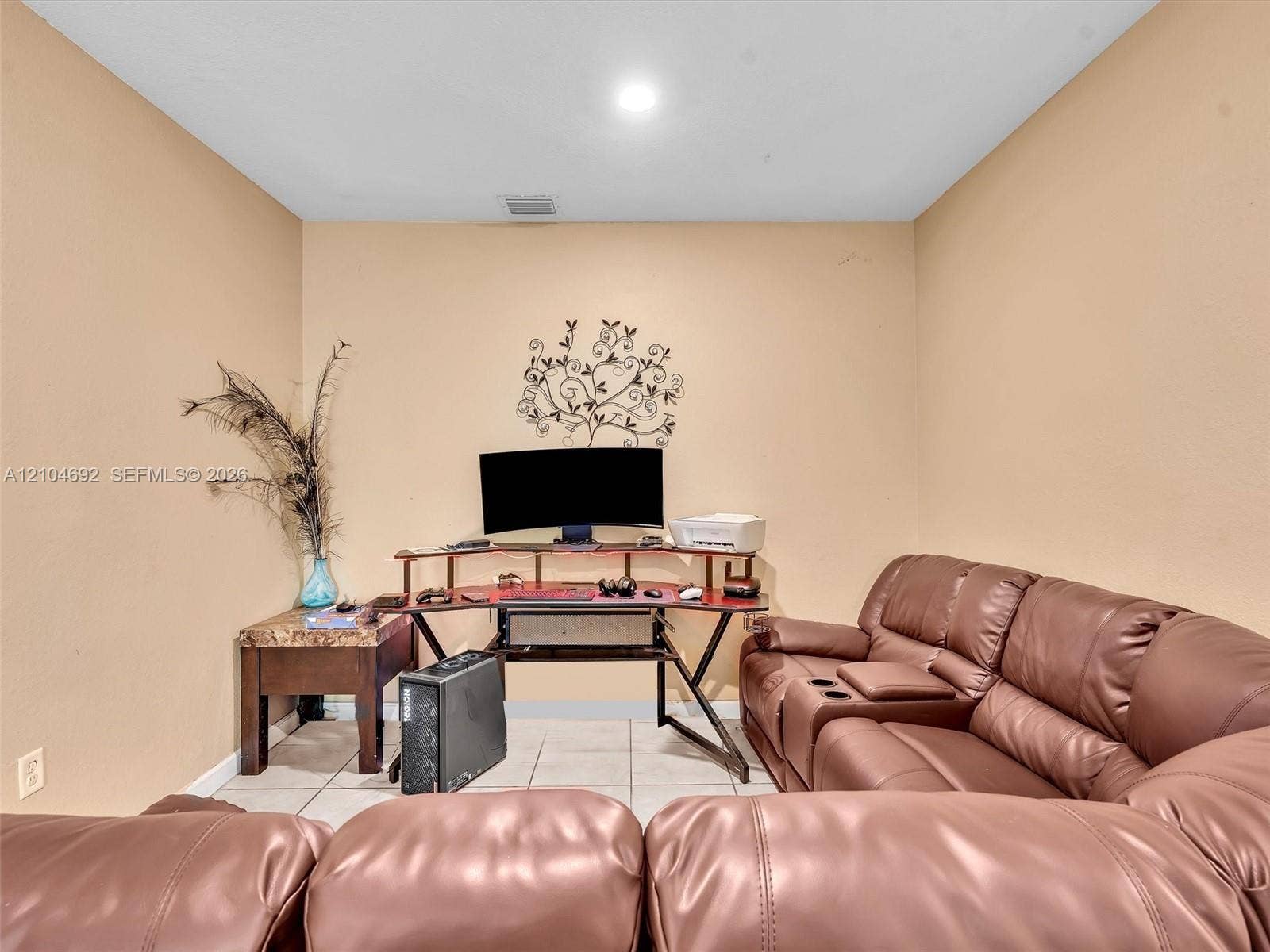 714 SE 37th Place, Homestead, FL 33033 Neutral-toned interior room featuring tile flooring and recessed ceiling lighting