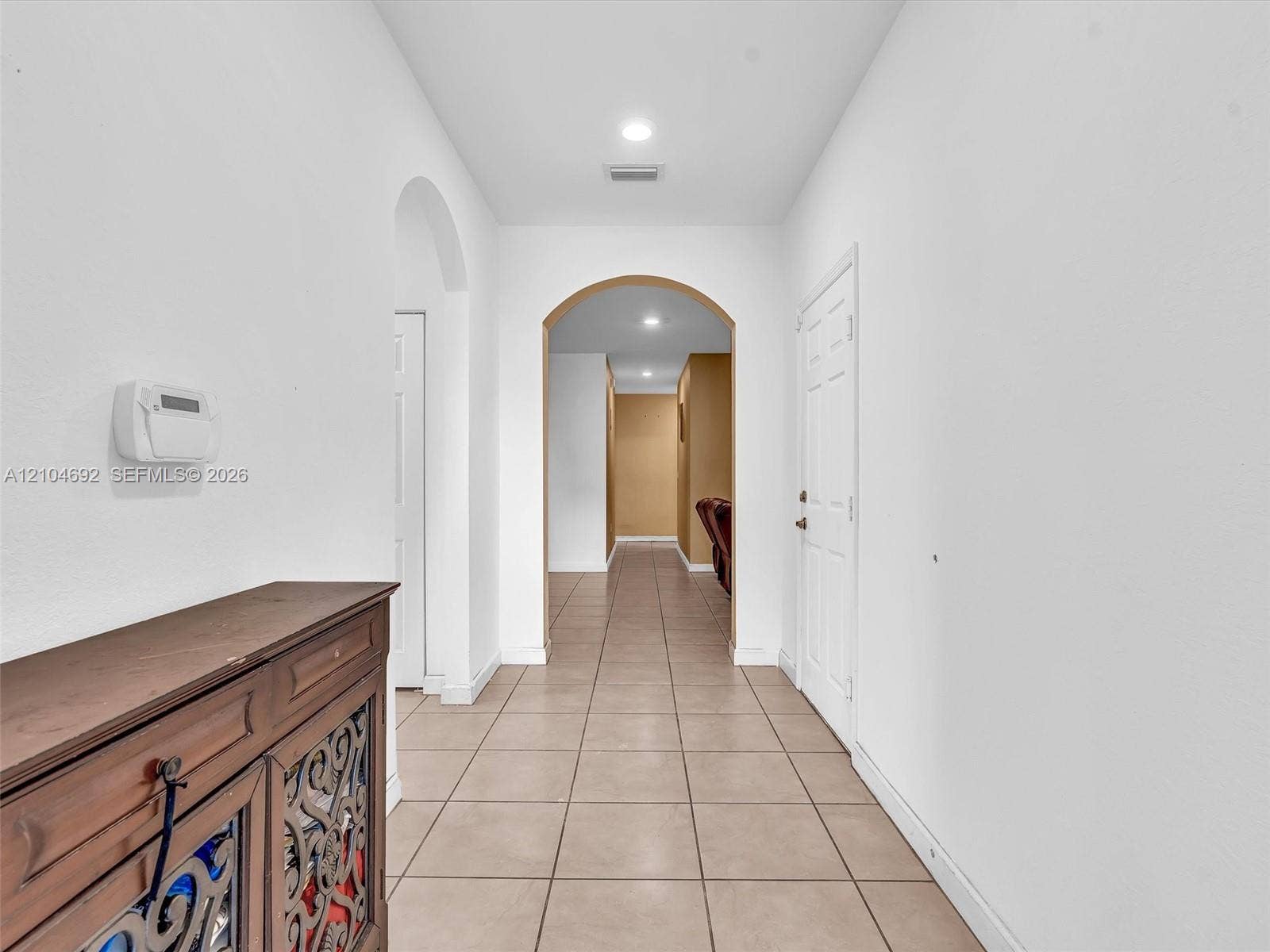 714 SE 37th Place, Homestead, FL 33033 Ceramic tile flooring, arched entryways, and recessed lighting