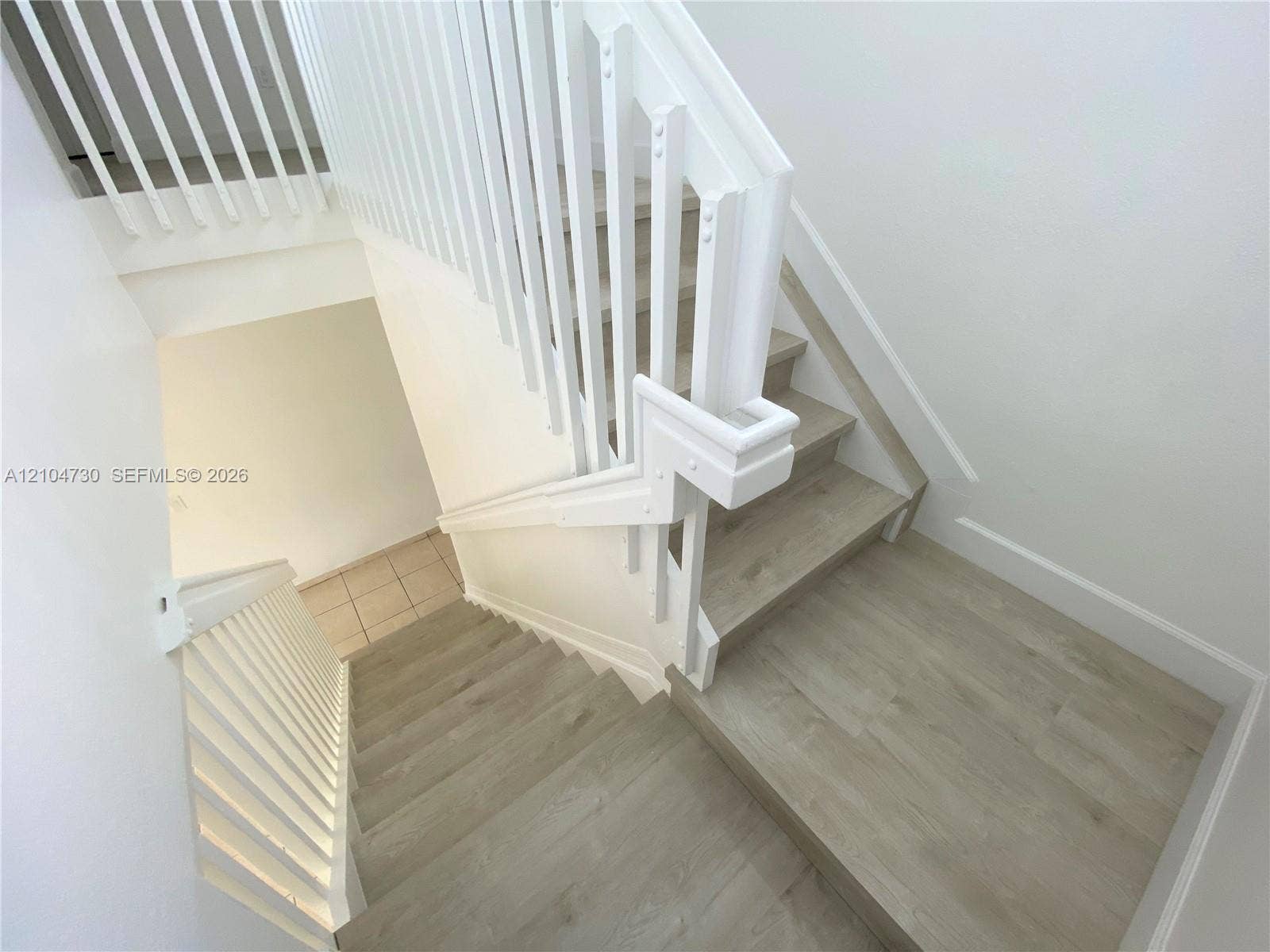 13832 SW 273rd Terrace, #13832, Homestead, Homestead, FL 33032 Stairs with recently installed laminated flooring.