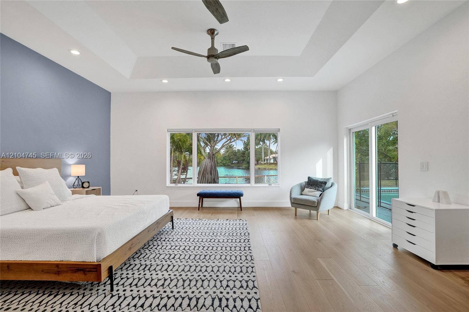 Tray ceiling with recessed lighting and a ceiling fan