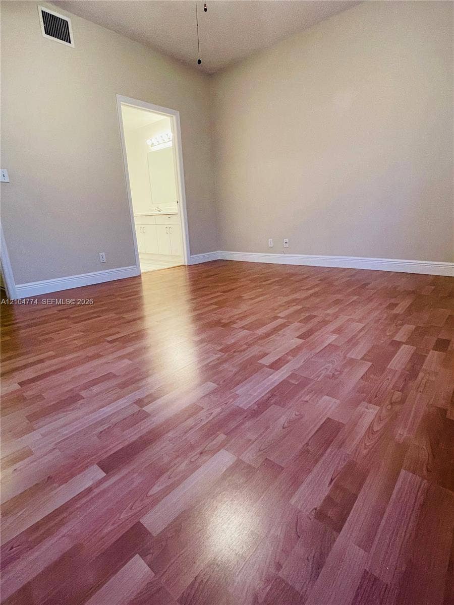1503 Veracruz Lane, #5-14, Weston, Weston, FL 33327 High-ceiling interior space featuring wood-finish flooring and neutral wall tones