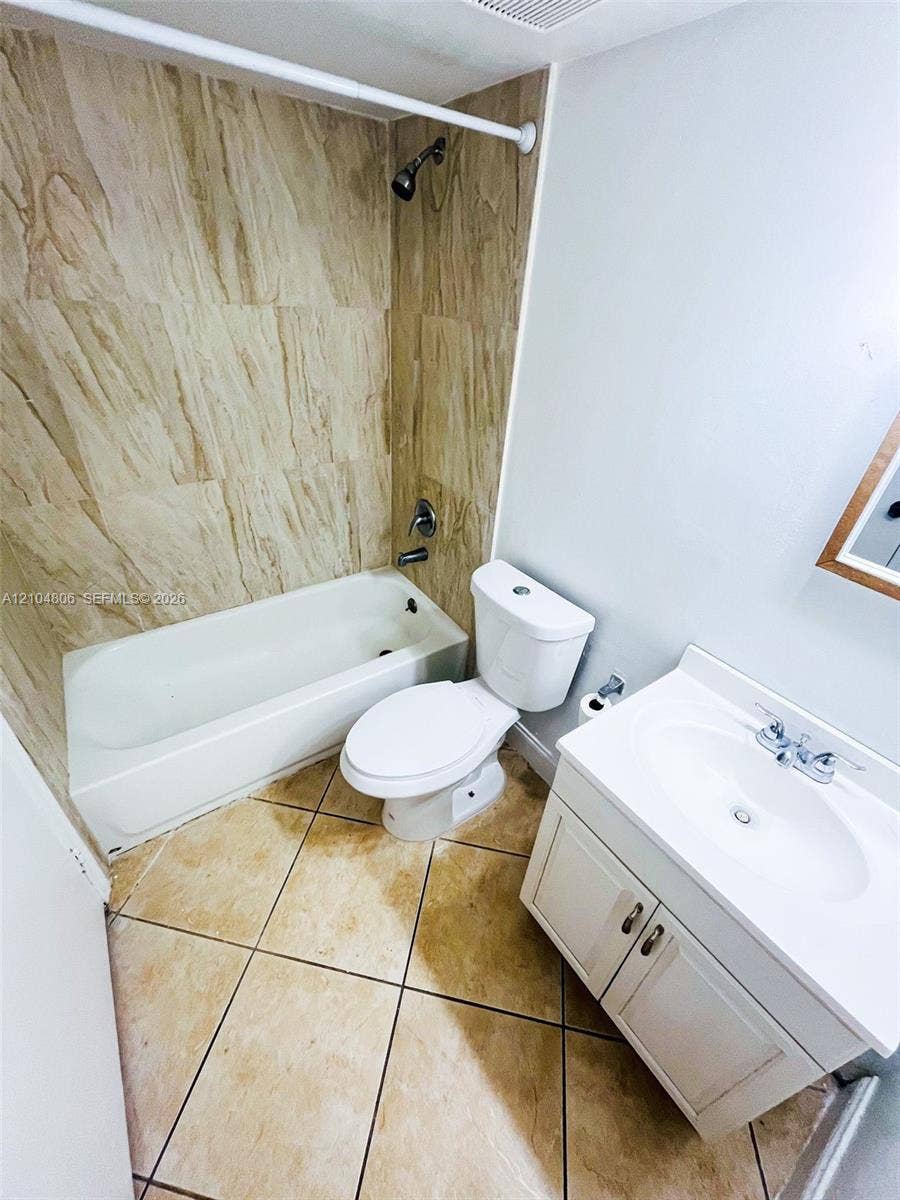 10451 SW 157th Place, #303, Miami, FL 33196 White vanity with integrated sink, chrome faucet, and cabinet storage