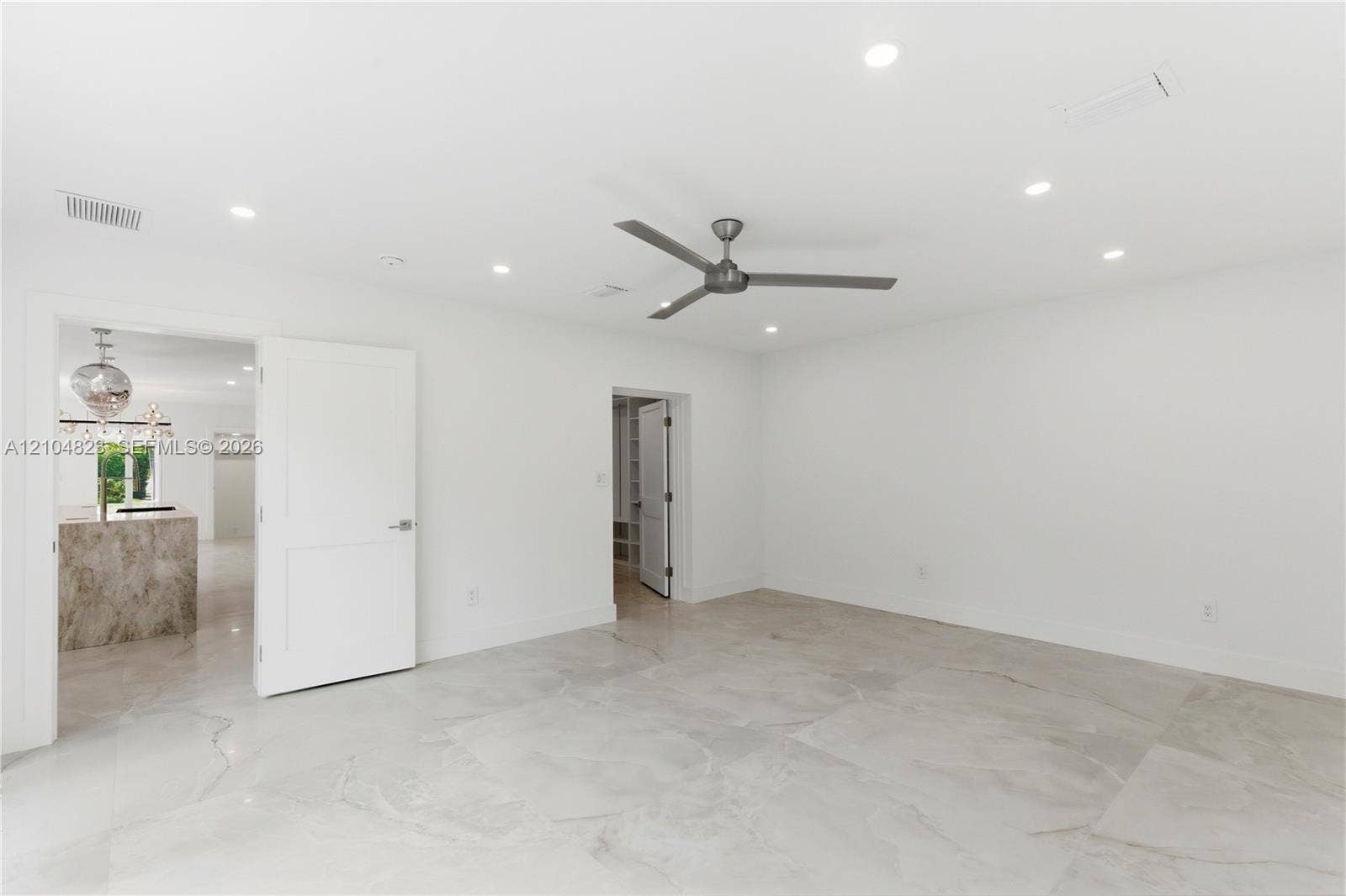291 E Shore Drive E, Miami, FL 33133 Neutral-toned tile flooring, recessed ceiling lighting, and a modern ceiling fan