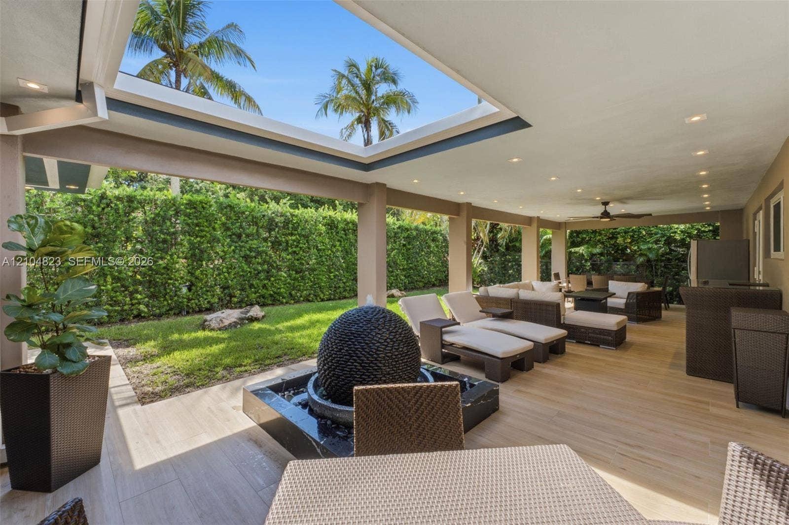 291 E Shore Drive E, Miami, FL 33133 Expansive covered patio featuring a skylight, recessed lighting, and a ceiling fan