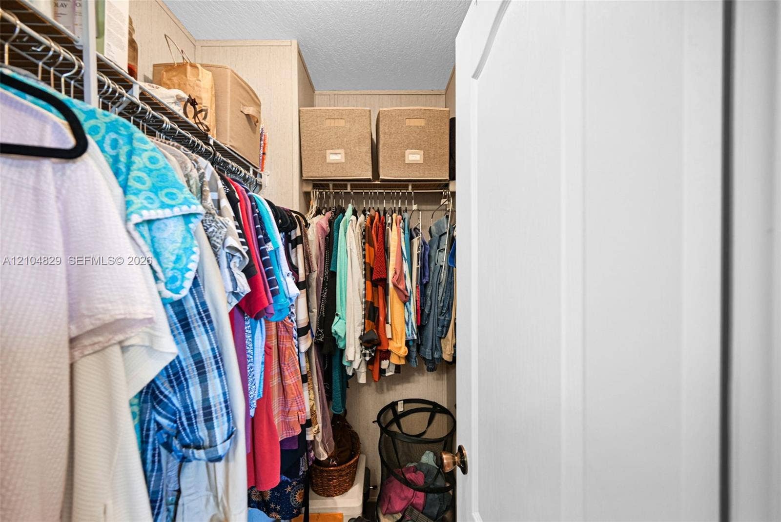 1880 SW 83rd Terrace, Davie, FL 33324 Storage closet featuring tiered wire shelving and integrated upper storage compartments