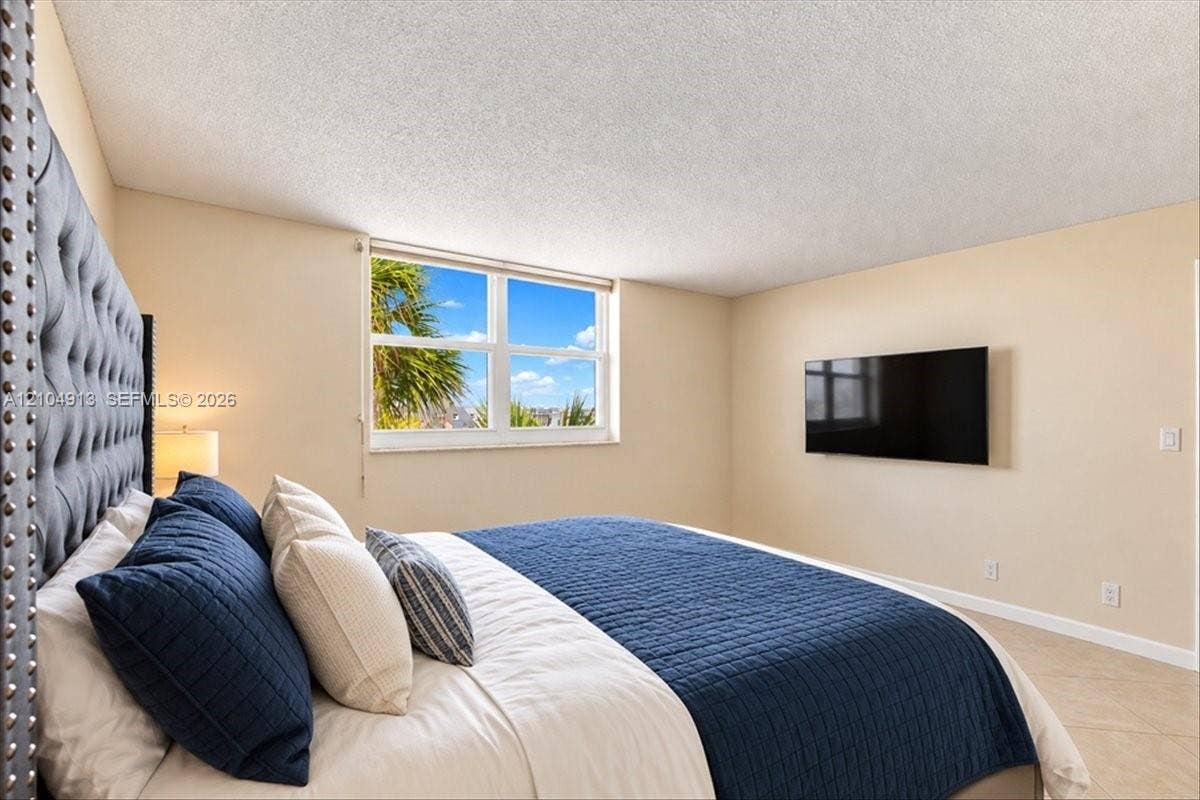 501 E Dania Beach Boulevard, #5-4A, Dania, Dania Beach, FL 33004 Room featuring neutral wall paint, large picture window, and tile flooring