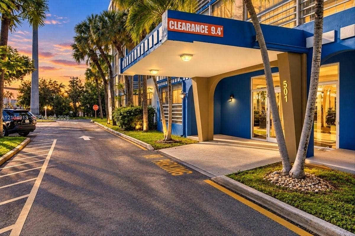 501 E Dania Beach Boulevard, #5-4A, Dania, Dania Beach, FL 33004 Covered porte-cochere entry with flush-mounted lighting, structured archways, and mature landscaping