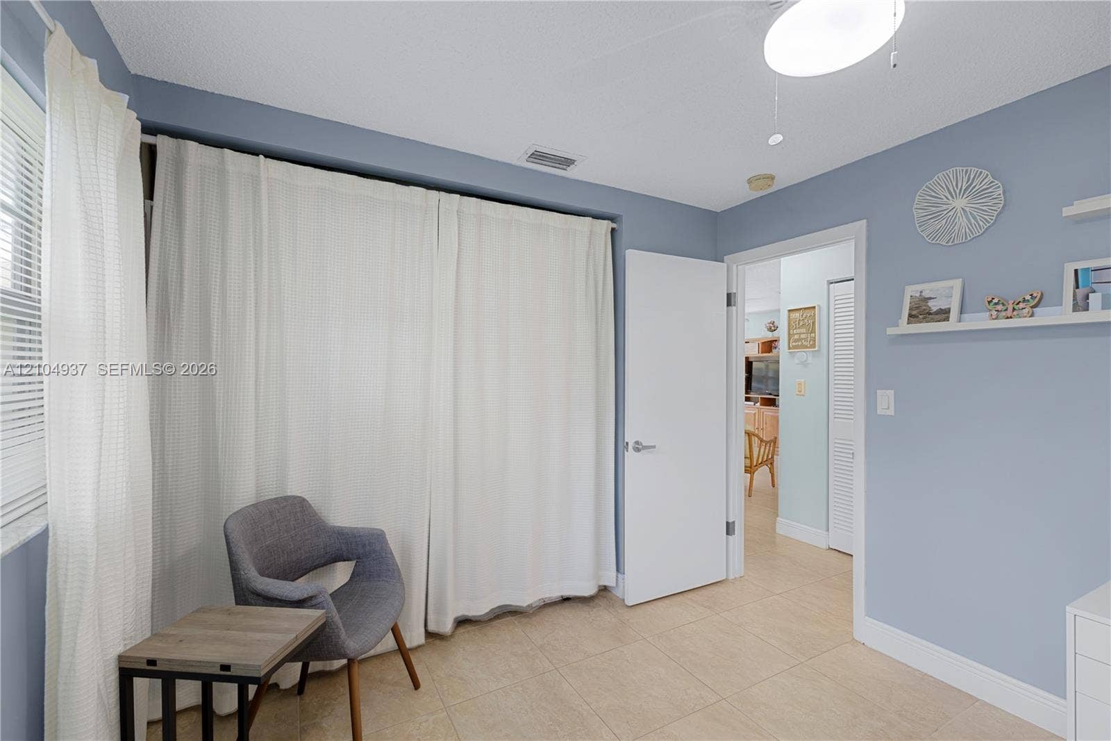 4108 NW 88th Avenue, #3, Coral Springs, FL 33065 Room featuring tile flooring, ceiling-mounted lighting, and built-in wall shelving