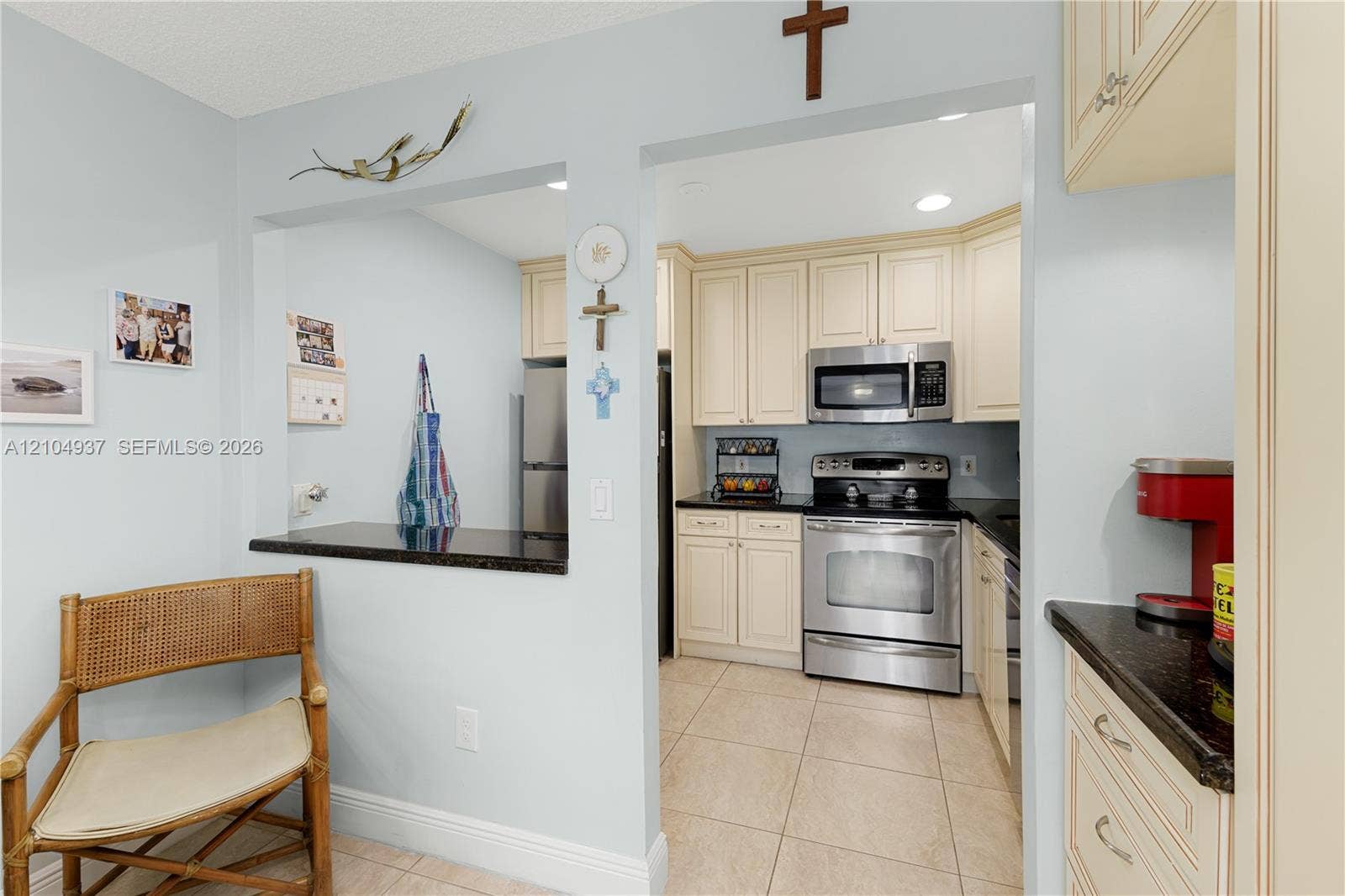 4108 NW 88th Avenue, #3, Coral Springs, FL 33065 Kitchen featuring off-white cabinetry, dark stone countertops, stainless steel appliances, and ceramic tile flooring