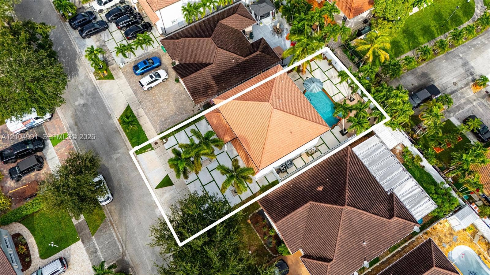15217 SW 36th Terrace, #0, Miami, Miami, FL 33185 Aerial view of property featuring a hip roof, swimming pool, paver patio, and mature landscaping