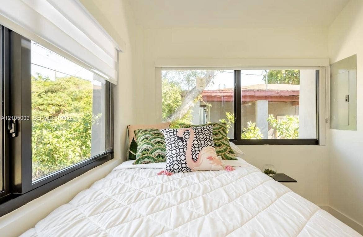 254 NW 51st Street, Miami, Miami, FL 33127 Dual windows with black frames and white window treatments