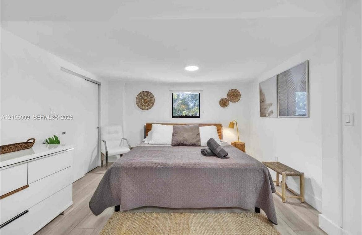 254 NW 51st Street, Miami, Miami, FL 33127 Light wood-finish flooring, white walls, and a recessed ceiling light