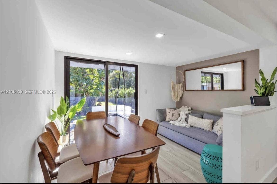 254 NW 51st Street, Miami, Miami, FL 33127 Sliding glass doors, recessed lighting, wood-finish flooring, and a half-wall partition