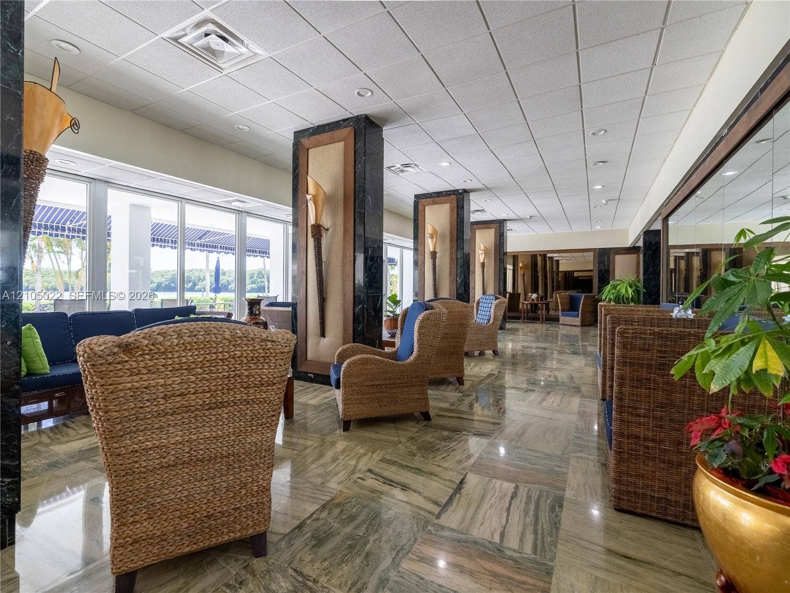 500 Bayview Drive, #1520, Sunny Isles Beach, Sunny Isles Beach, FL 33160 Polished stone flooring with natural variations, floor-to-ceiling windows, and recessed lighting