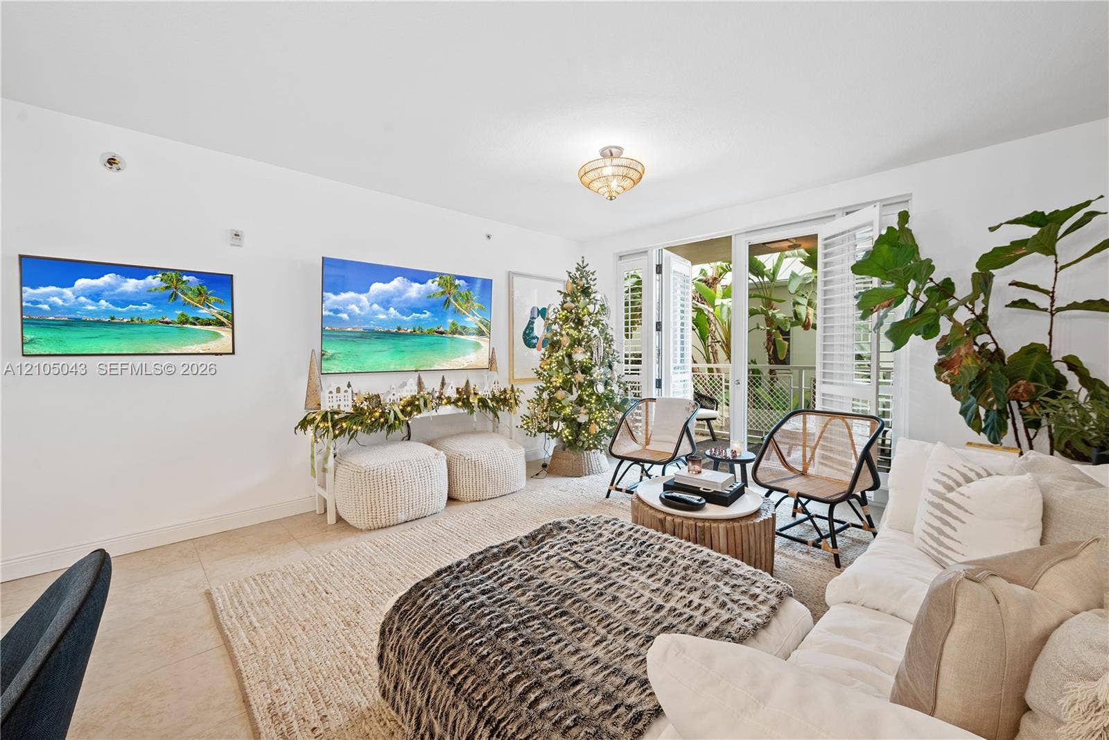 3540 Main Highway, #207, Miami, FL 33133 Open-concept interior featuring large-format tile flooring, recessed ceiling lighting, and a kitchen equipped with stainless steel appliances, wood-finish cabinetry, and a stone-surface breakfast bar
