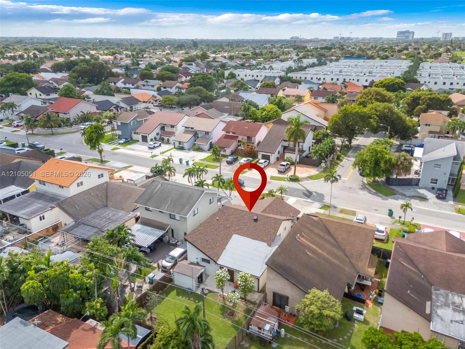 461 SW 89th Court, Miami, FL 33174 Aerial perspective featuring a shingled roof, fenced backyard, and mature landscaping