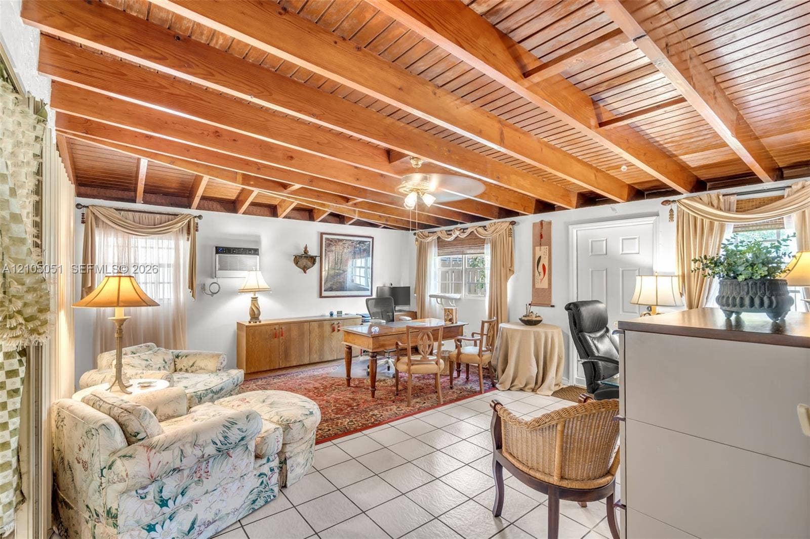 461 SW 89th Court, Miami, FL 33174 Room featuring exposed natural wood-toned ceiling beams
