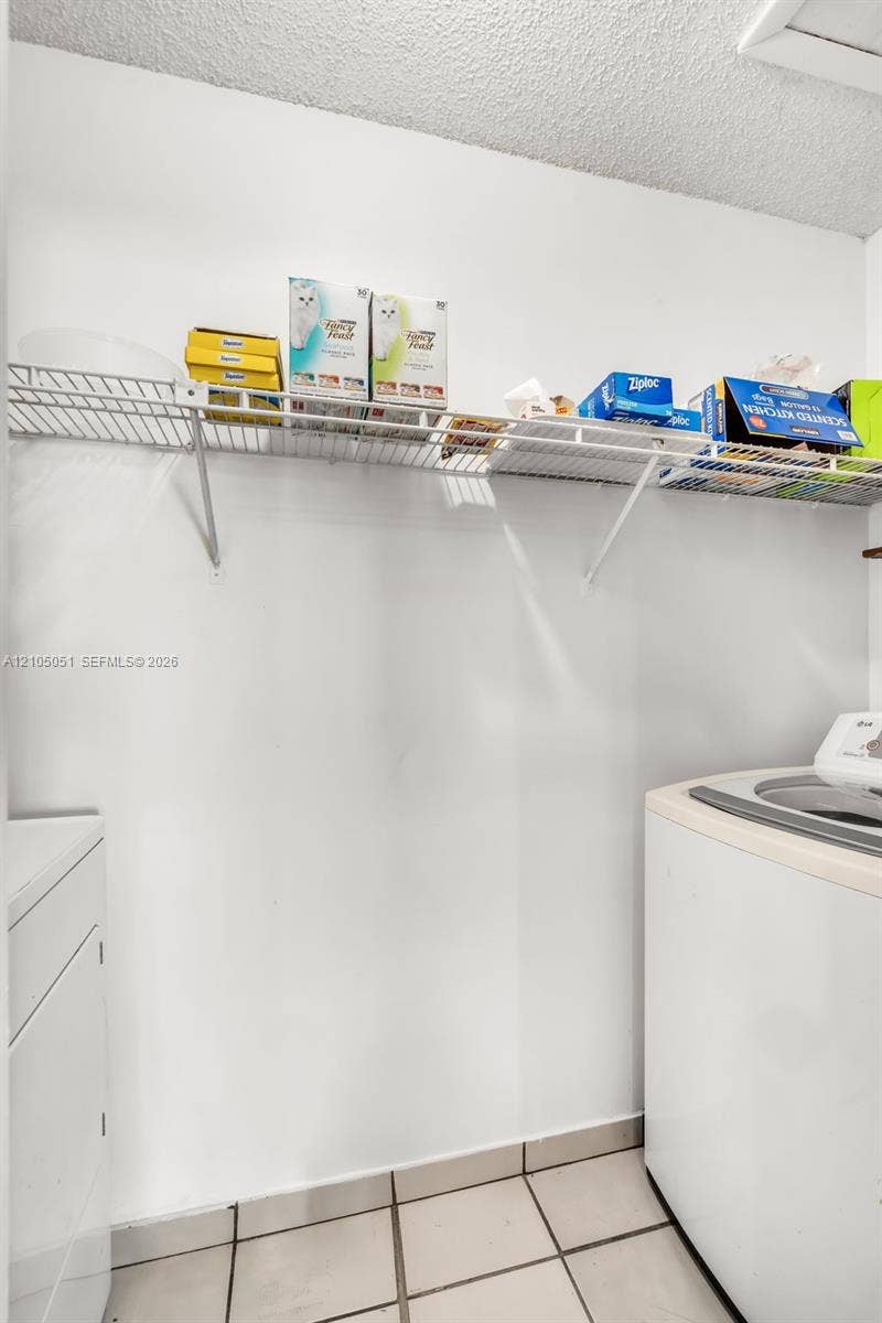 461 SW 89th Court, Miami, FL 33174 Laundry area featuring wall-mounted wire shelving
