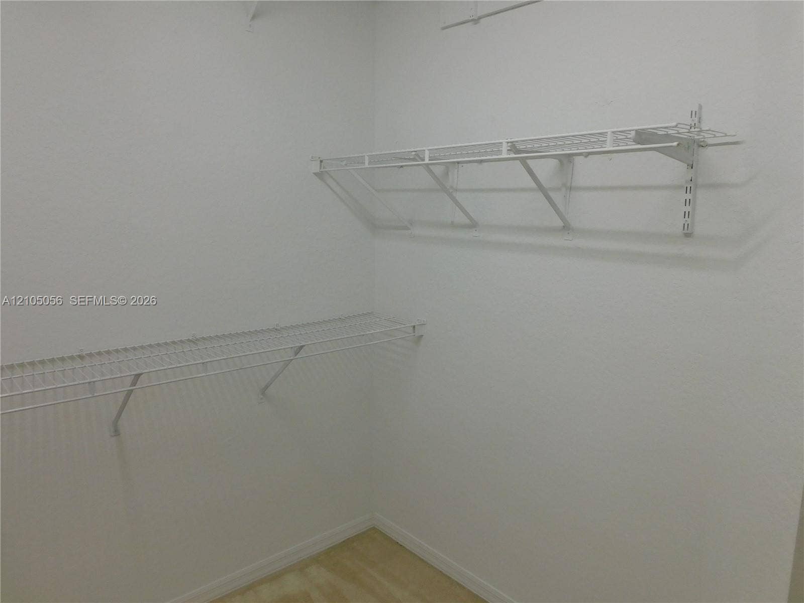 16729 Amber Lake, Weston, FL 33331 White wire shelving system at Primary Closet.