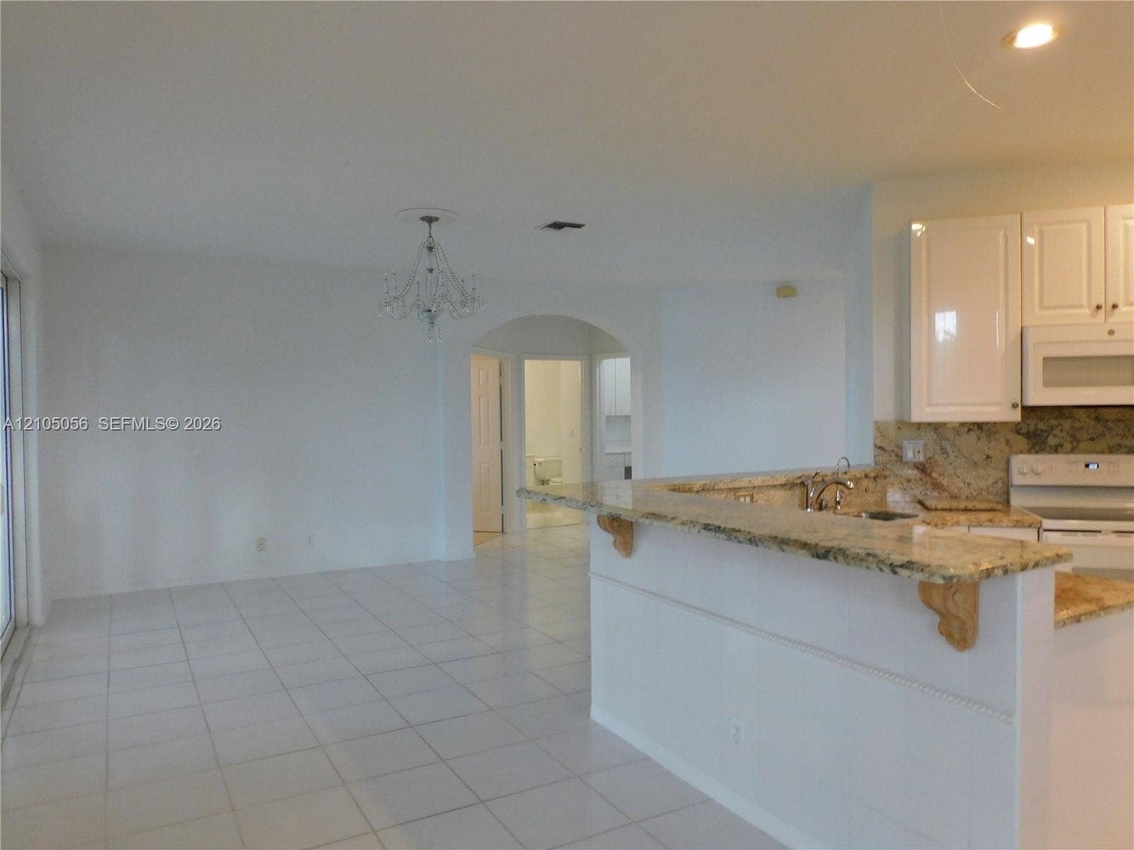 16729 Amber Lake, Weston, FL 33331 View from breakfast area to family room - plenty of wall space for a large TV - perfect for game days with family and friends.