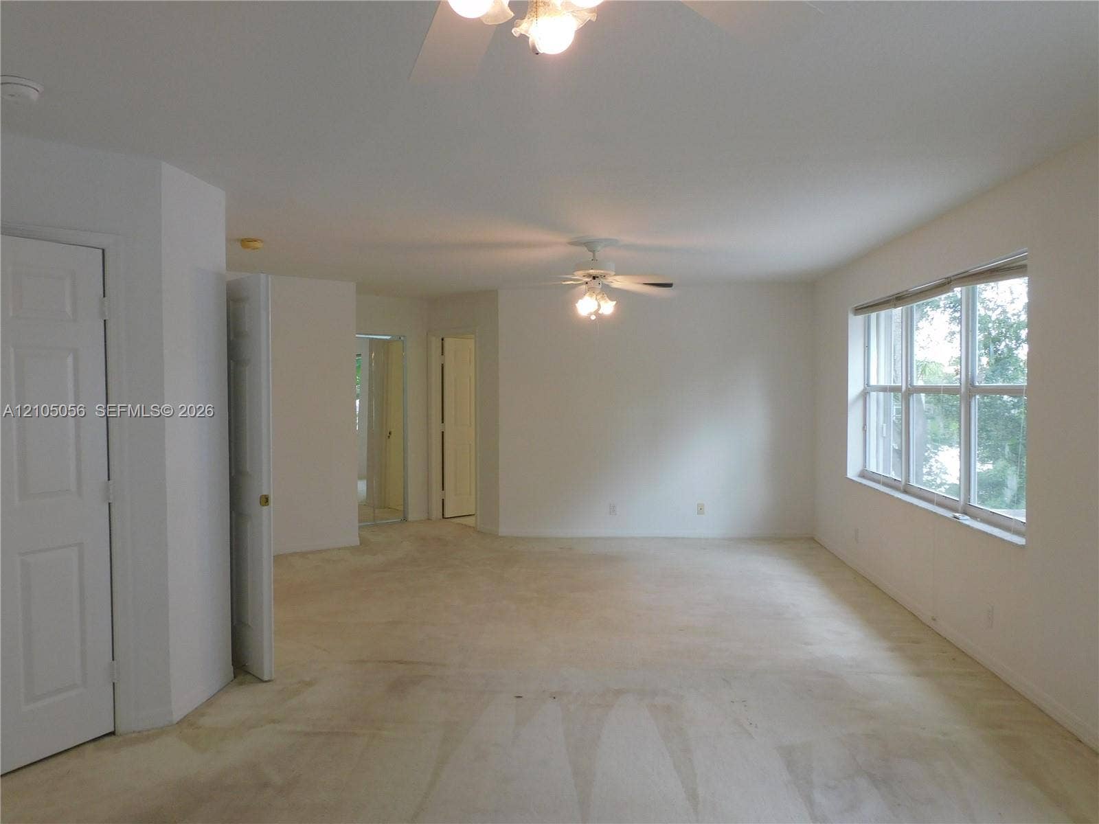 16729 Amber Lake, Weston, FL 33331 Spacious Primary Suite with with multiple entryways, neutral-toned carpeting, and a window with a multi-pane grid - endless possibilities - sitting area - convert to 5th bedroom -options to suit your needs.