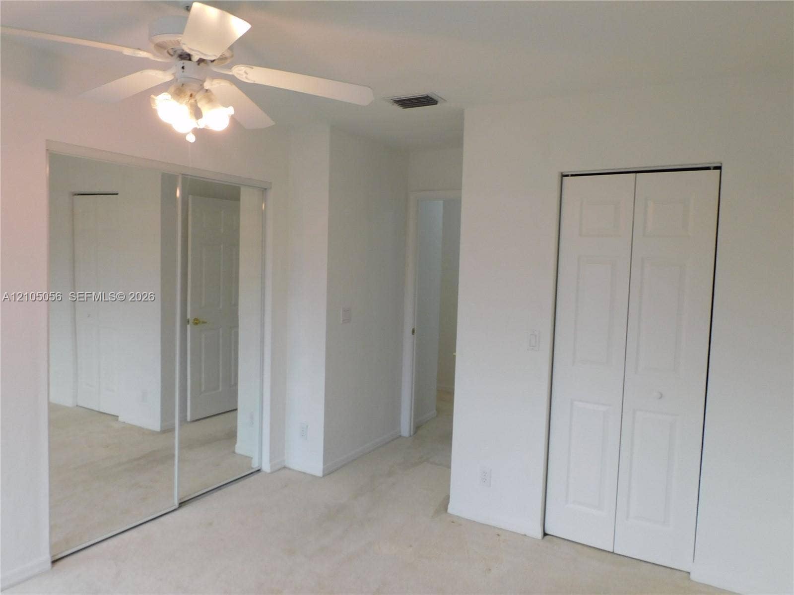 16729 Amber Lake, Weston, FL 33331 2nd Bedroom -Recessed lighting, ceiling fan with light fixture, mirrored closet doors, and bi-fold closet doors