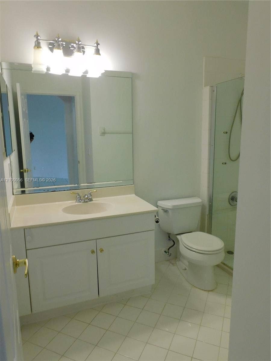 16729 Amber Lake, Weston, FL 33331 Downstairs Full Bathroom with White vanity with integrated sink, chrome faucet, and overhead lighting