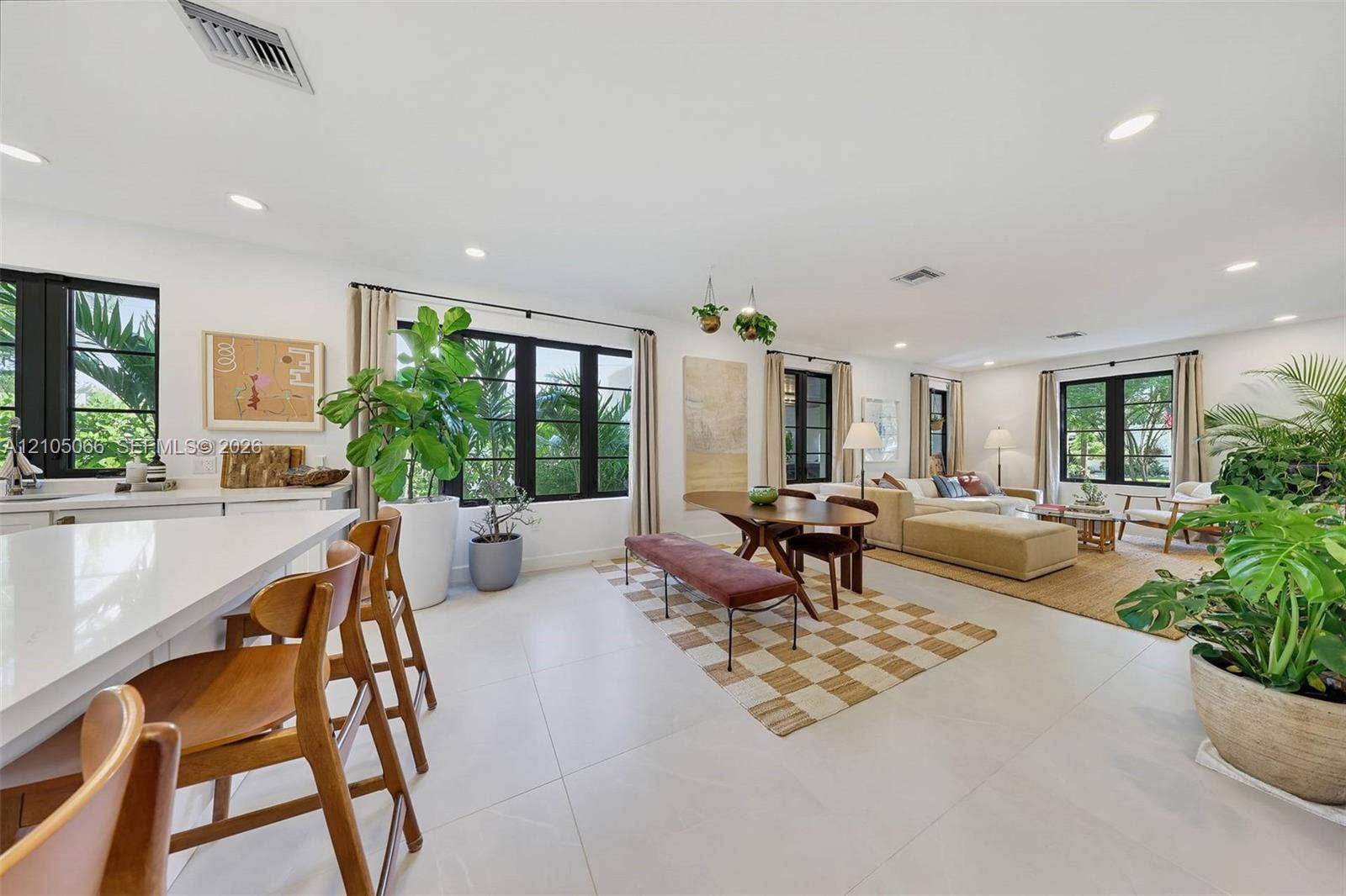 1230 Genoa Street, Coral Gables, Coral Gables, FL 33134 Open-concept interior featuring large-format tile flooring, recessed lighting, and multiple windows with black trim