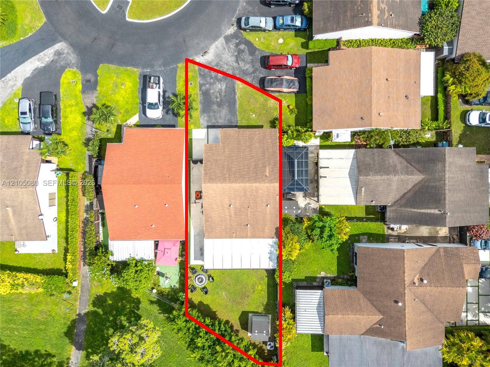 9755 SW 148th Court, Miami, FL 33196 Aerial view featuring a paved driveway, shingle roof, rear concrete patio, and fenced perimeter